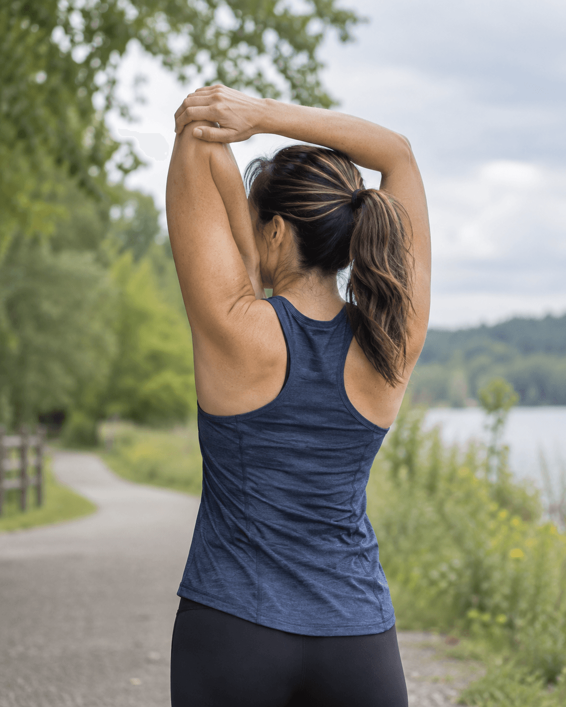 Adult practicing shoulder mobility outdoors